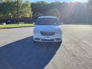 White Chrysler Town and Country with BraunAbility Side Entry Automatic Fold Out conversion