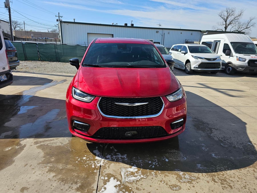 Red Chrysler Pacifica with Driverge Side Entry Automatic Fold Out conversion