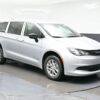 Silver Chrysler Voyager with BraunAbility Rear Entry Manual Fold Out conversion