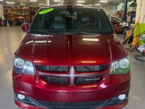 Red Dodge Grand Caravan with Adaptive Vans Side Entry Automatic Fold Out conversion