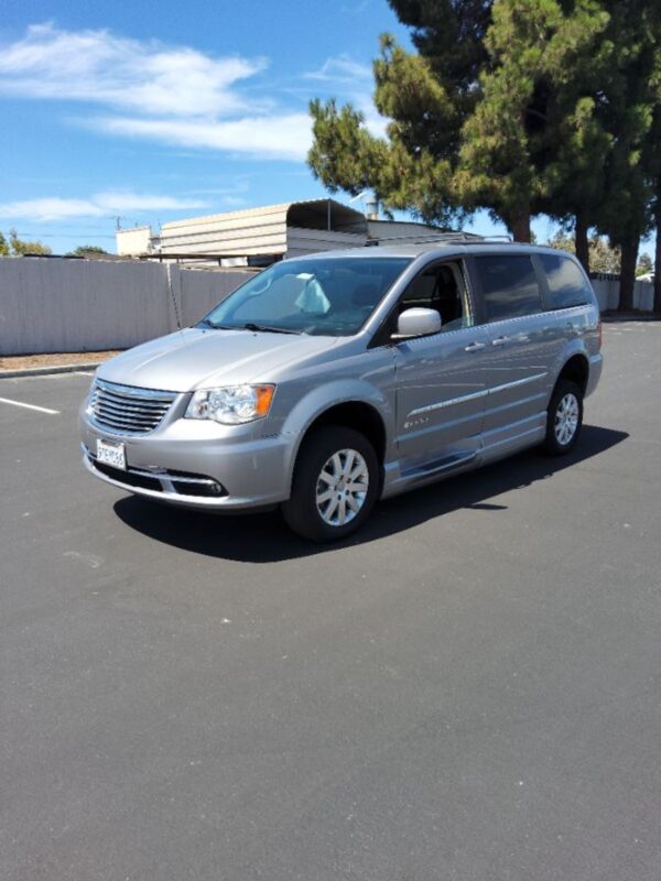 Silver Chrysler Town and Country with BraunAbility Side Entry Automatic Fold Out conversion