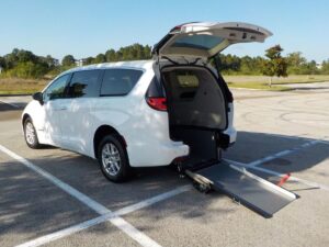 White Chrysler Pacifica with Driverge Rear Entry Manual Fold Out conversion