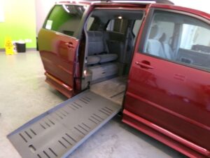 Red Toyota Sienna with BraunAbility Side Entry Automatic Fold Out conversion