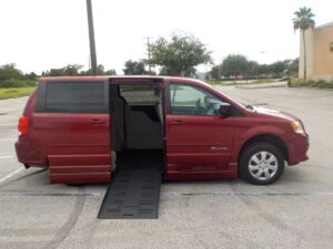 Red Dodge Grand Caravan with BraunAbility Side Entry Automatic Fold Out conversion
