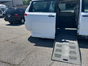 White Toyota Sienna with BraunAbility Side Entry Manual Fold Out conversion