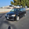 Black Dodge Grand Caravan with BraunAbility Side Entry Manual Fold Out conversion