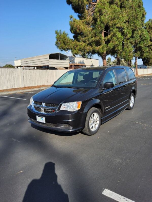 Black Dodge Grand Caravan with BraunAbility Side Entry Manual Fold Out conversion