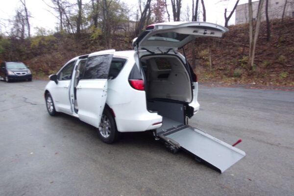 White Chrysler Voyager with Driverge Rear Entry Manual Fold Out conversion