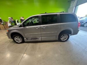 Silver Dodge Grand Caravan with BraunAbility Side Entry Automatic Fold Out conversion