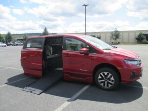 Red Honda Odyssey with BraunAbility Side Entry Automatic In Floor conversion