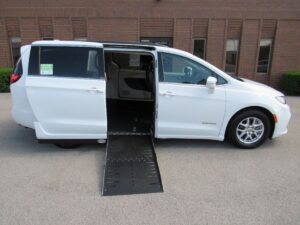 White Chrysler Pacifica with Driverge Side Entry Automatic Fold Out conversion