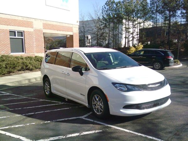 White Chrysler Voyager with Driverge Side Entry Automatic Fold Out conversion