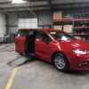 Red Chrysler Pacifica with Driverge Side Entry Automatic Fold Out conversion