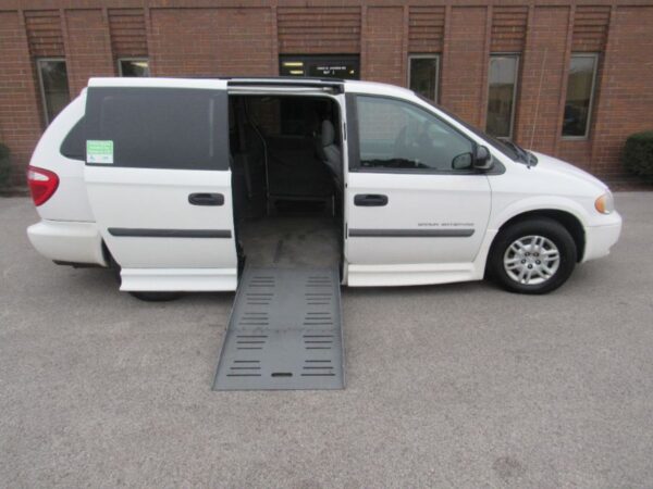 White Dodge Grand Caravan with BraunAbility Side Entry Automatic Fold Out conversion