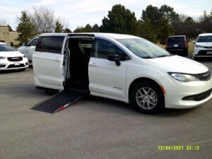 White Chrysler Voyager with Driverge Side Entry Automatic Fold Out conversion