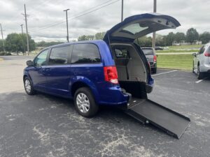 Blue Dodge Grand Caravan with International Sales and Mobility Rear Entry Manual Fold Out conversion