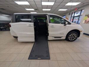 White Honda Odyssey with BraunAbility Side Entry Automatic In Floor conversion