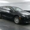 Black Chrysler Voyager with BraunAbility Rear Entry Manual Fold Out conversion