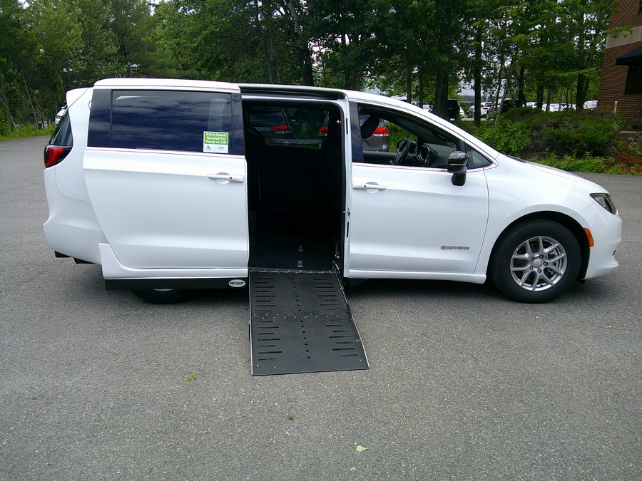 White Chrysler Voyager with Driverge Side Entry Automatic Fold Out conversion
