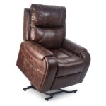 The Titan Lift Chair is a brown leather recliner featuring padded armrests, visible stitching, and a mechanical lift base.