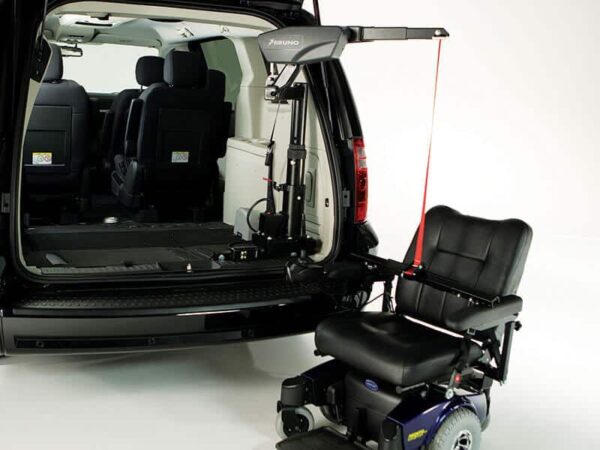 Big Lifter in back of minivan attached to two wheel power wheelchair
