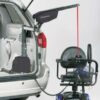 Curb Sider lift in back of silver minivan attached to blue power scooter