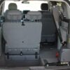 Curb Sider lift folded into trunk of minivan with back bucket seat folded down