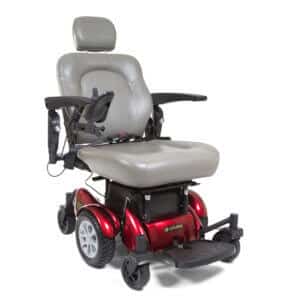 front view of red Compass Sport power wheelchair with foot rest