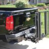 black pickup truck with out sider lift on back