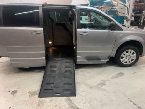 Silver Dodge Grand Caravan with BraunAbility Side Entry Manual Fold Out conversion
