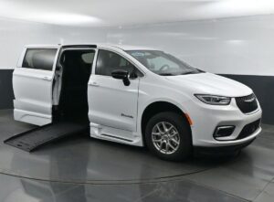White Chrysler Pacifica with BraunAbility Side Entry Automatic Fold Out conversion