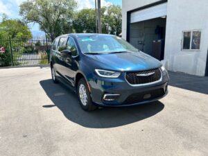 Blue Chrysler Pacifica with BraunAbility Side Entry Automatic Fold Out conversion