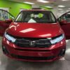 Red Honda Odyssey with BraunAbility Side Entry Automatic In Floor conversion