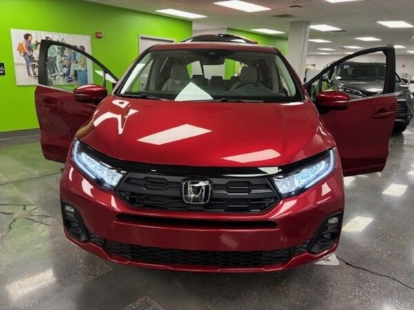Red Honda Odyssey with BraunAbility Side Entry Automatic In Floor conversion