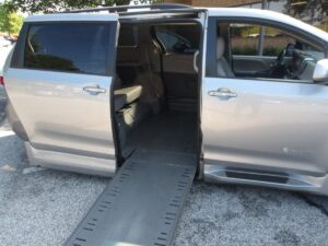 Silver Toyota Sienna with BraunAbility Side Entry Automatic In Floor conversion