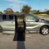 Green Honda Odyssey with BraunAbility Side Entry Automatic In Floor conversion