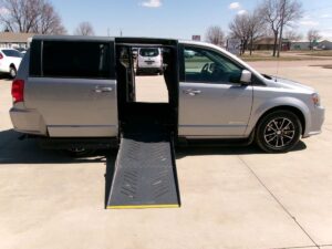 Silver Dodge Grand Caravan with Driverge Side Entry Automatic Fold Out conversion