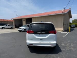 White Chrysler Voyager with Driverge Side Entry Automatic Fold Out conversion