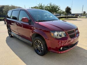 Red Dodge Grand Caravan with Adaptive Vans Side Entry Automatic Fold Out conversion