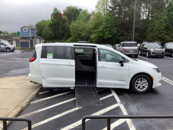White Chrysler Voyager with Driverge Side Entry Automatic Fold Out conversion
