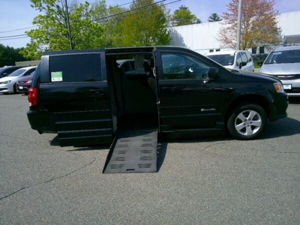 Black Dodge Grand Caravan with BraunAbility Side Entry Automatic Fold Out conversion