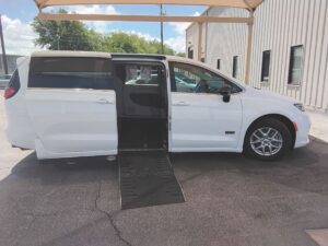 White Chrysler Pacifica with Driverge Side Entry Automatic Fold Out conversion
