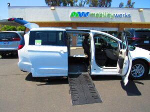 White Chrysler Pacifica with Driverge Side Entry Automatic Fold Out conversion