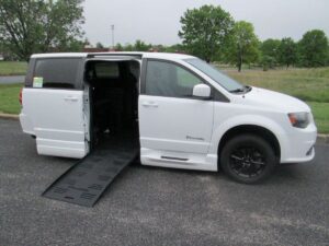 White Dodge Grand Caravan with BraunAbility Side Entry Automatic Fold Out conversion