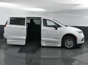 White Chrysler Pacifica with BraunAbility Side Entry Automatic Fold Out conversion