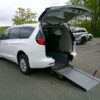 White Chrysler Voyager with Driverge Rear Entry Manual Fold Out conversion