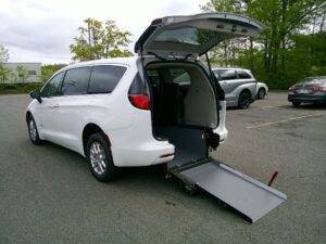 White Chrysler Voyager with Driverge Rear Entry Manual Fold Out conversion