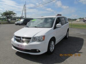 White Dodge Grand Caravan with Adaptive Vans Side Entry Automatic Fold Out conversion