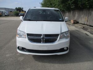 White Dodge Grand Caravan with BraunAbility Side Entry Automatic Fold Out conversion