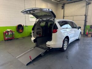 White Chrysler Voyager with Driverge Rear Entry Manual Fold Out conversion